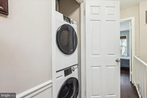 a view of a hallway with washer and dryer