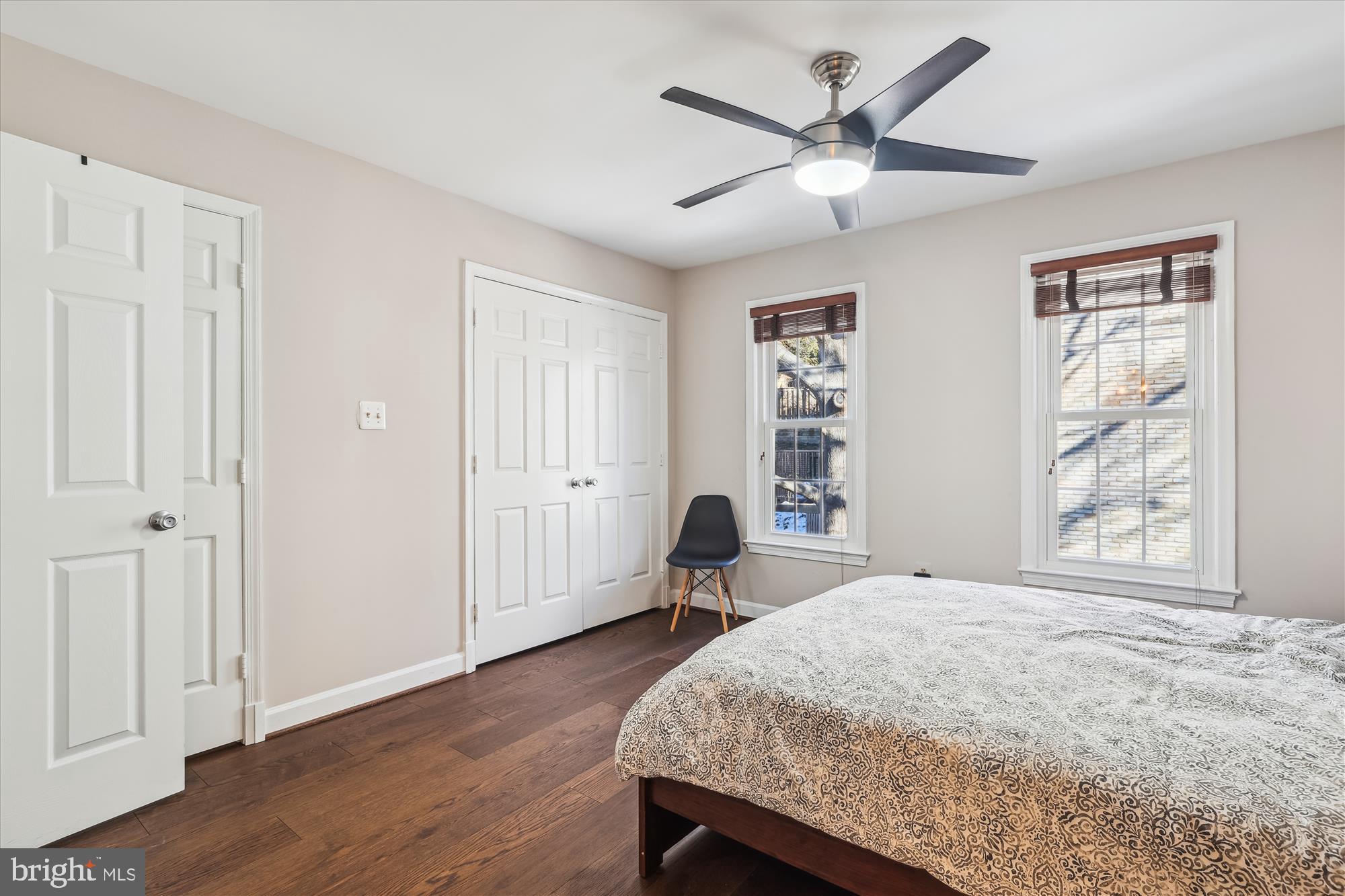 4611 1/2 MacArthur Boulevard Northwest, Unit B Washington, DC 20007 - Photo 31 of 43 a bedroom with a bed and a chandelier