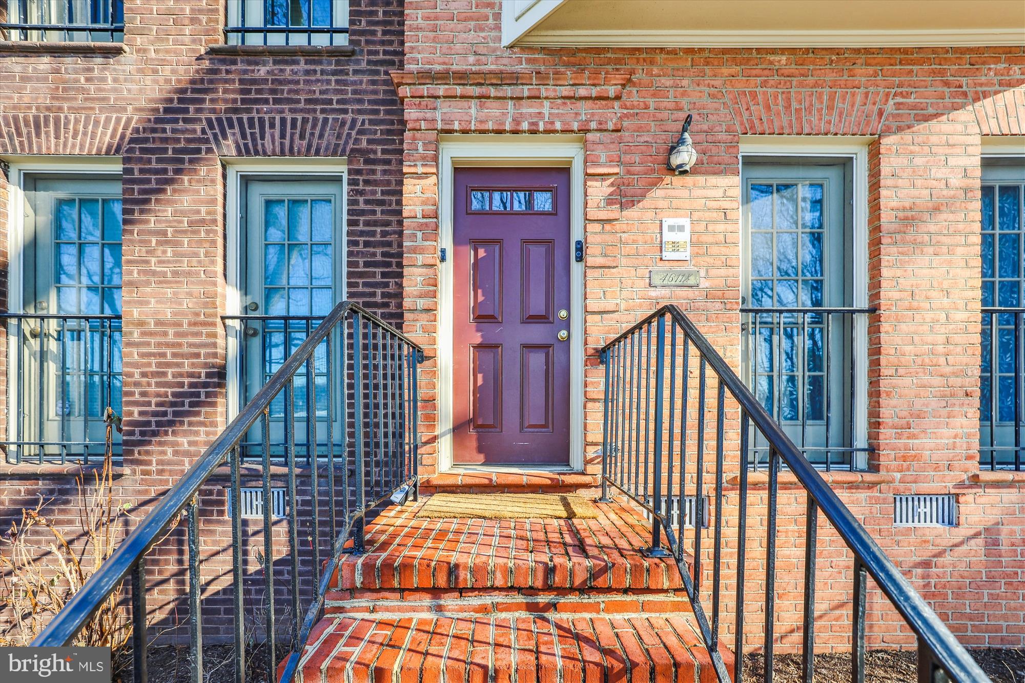 4611 1/2 MacArthur Boulevard Northwest, Unit B Washington, DC 20007 - Photo 4 of 43 a view of front door of house with stairs