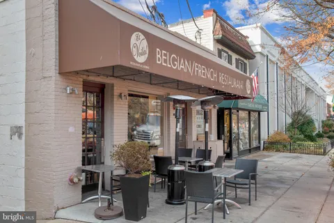 a view of a building with sitting area