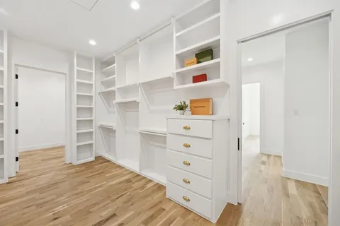 a view of a walk in closet and bedroom