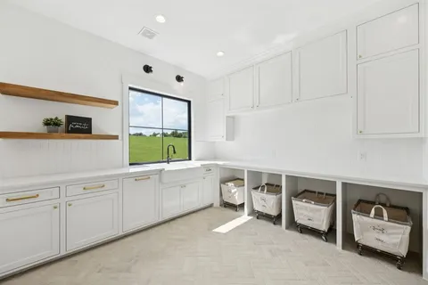a kitchen with a cabinets and window