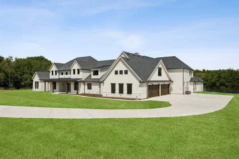 a front door view of a house with a yard