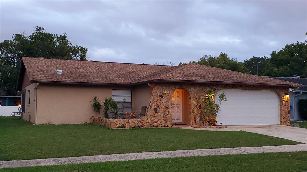 5104 Doefield Lane New Port Richey, FL 34653 - Photo 1 of 1 a backyard of a house with lots of green space