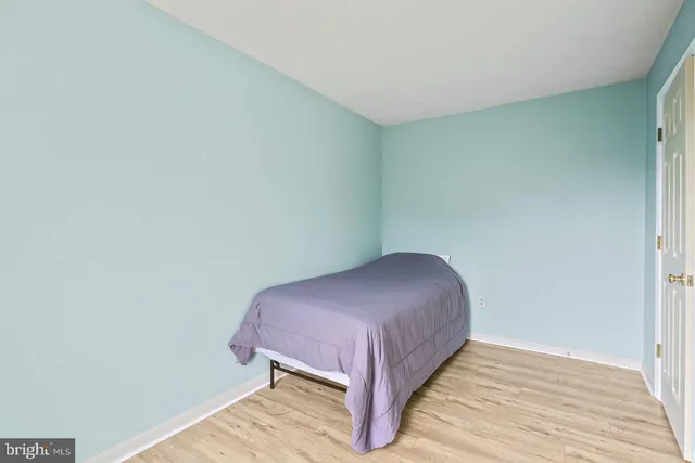 a bedroom with a bed and a table