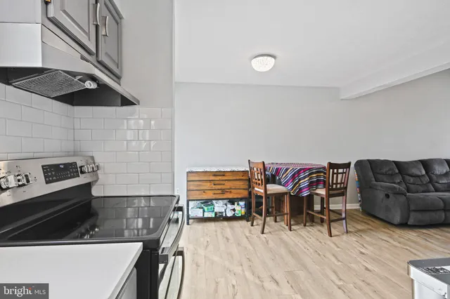 a bedroom with furniture and wooden floor