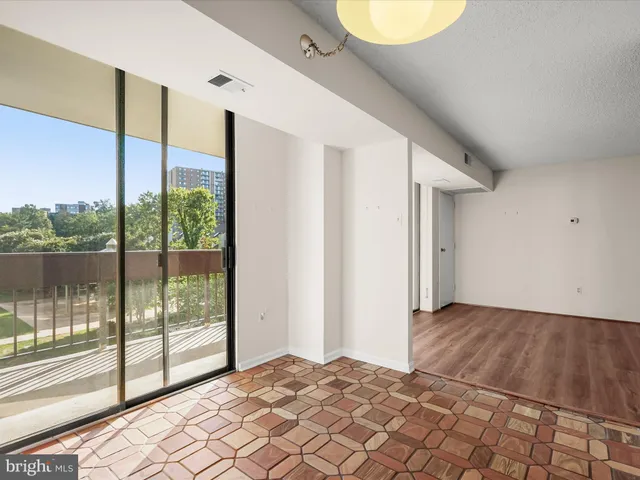 a kitchen with a sink a stove and cabinets