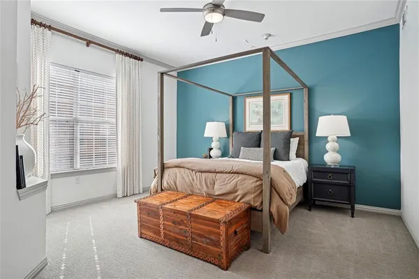 a bedroom with bed and window