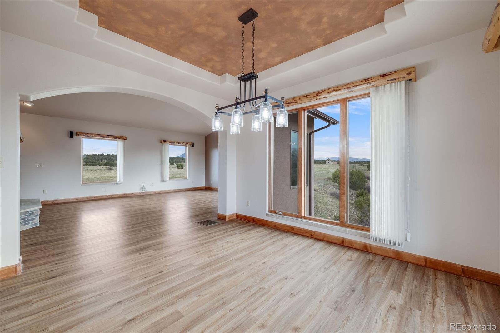 185 River Ridge Trail Walsenburg, CO 81089 - Photo 14 of 50 a view of a room with wooden floor fan and windows
