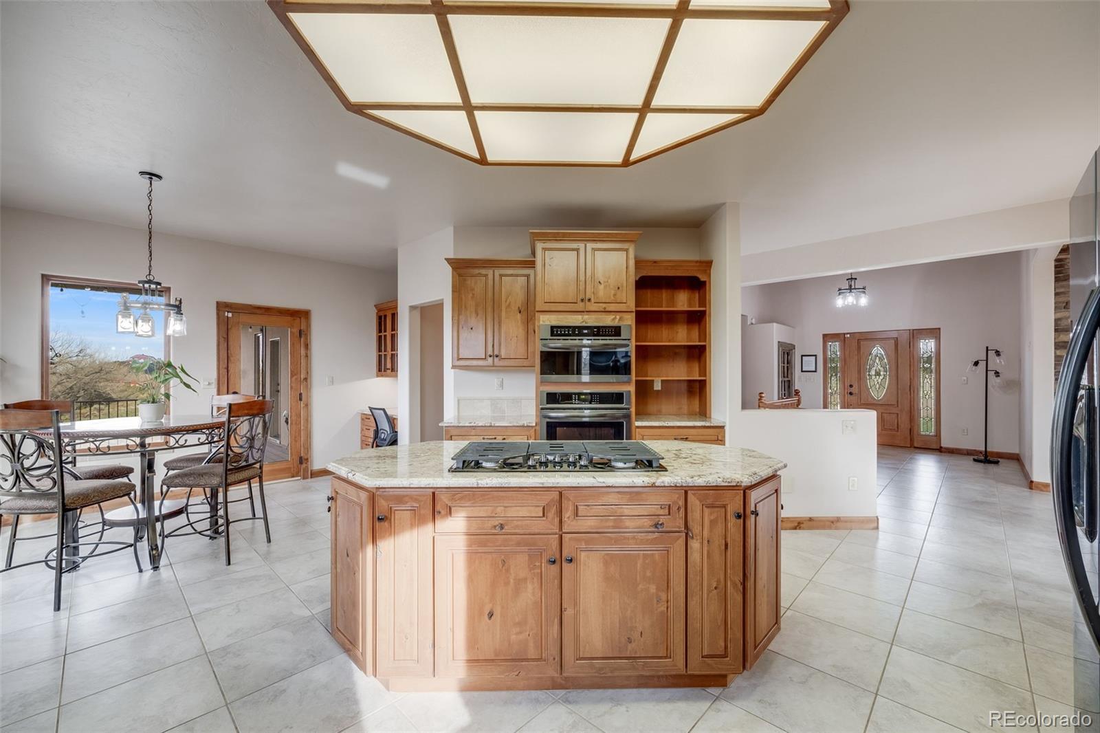 185 River Ridge Trail Walsenburg, CO 81089 - Photo 15 of 50 a dining hall with stainless steel appliances granite countertop a stove and cabinets