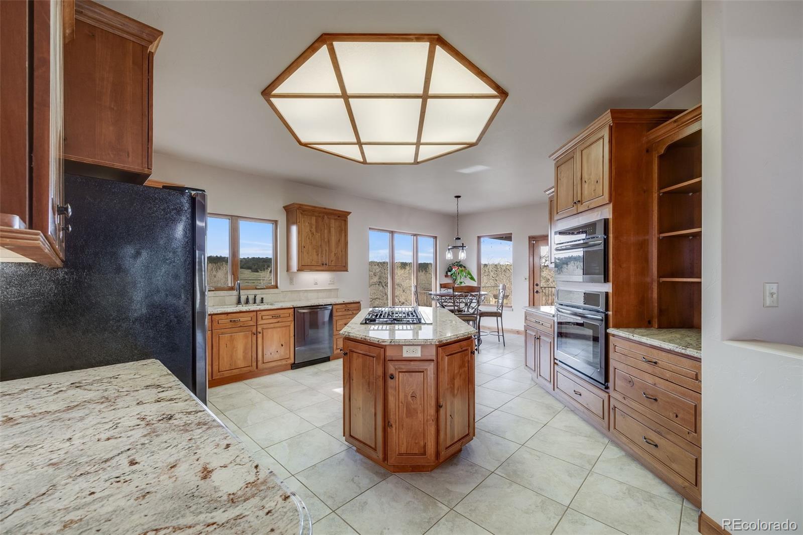 185 River Ridge Trail Walsenburg, CO 81089 - Photo 17 of 50 a living room with couches a dining table and kitchen view