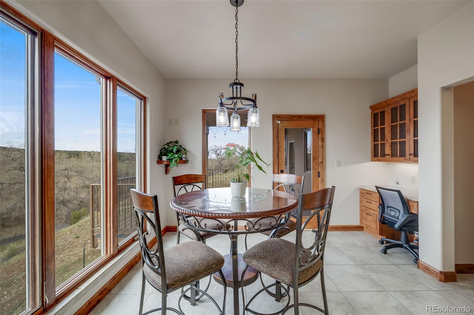 185 River Ridge Trail Walsenburg, CO 81089 - Photo 18 of 50 a dining room with furniture a chandelier and wooden floor