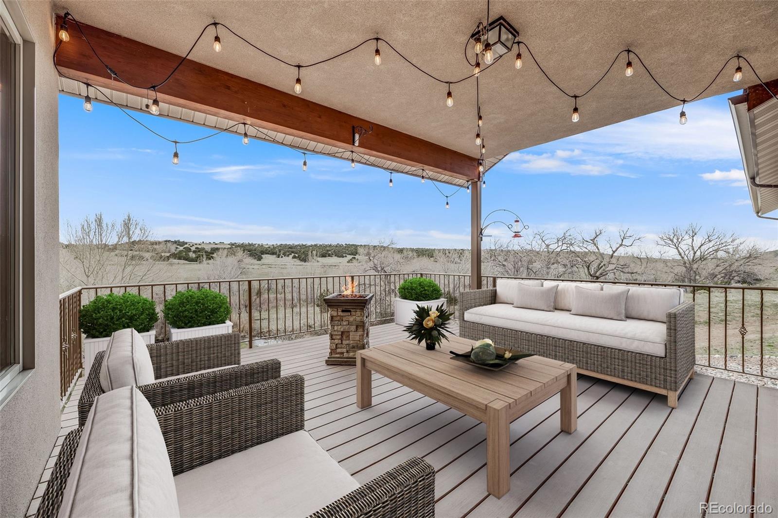 185 River Ridge Trail Walsenburg, CO 81089 - Photo 19 of 50 a roof deck with couches and potted plants