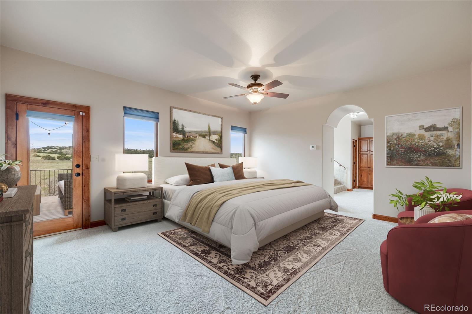 185 River Ridge Trail Walsenburg, CO 81089 - Photo 20 of 50 a spacious bedroom with a large bed chandelier and a window