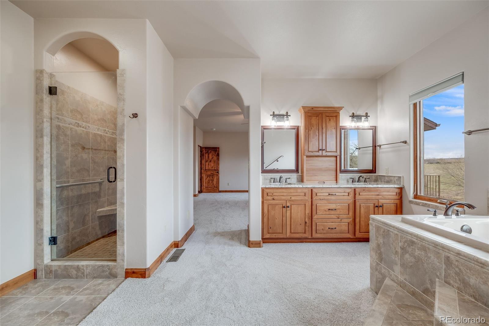 185 River Ridge Trail Walsenburg, CO 81089 - Photo 23 of 50 a large spacious bathroom with a granite countertop sink mirror and bathtub