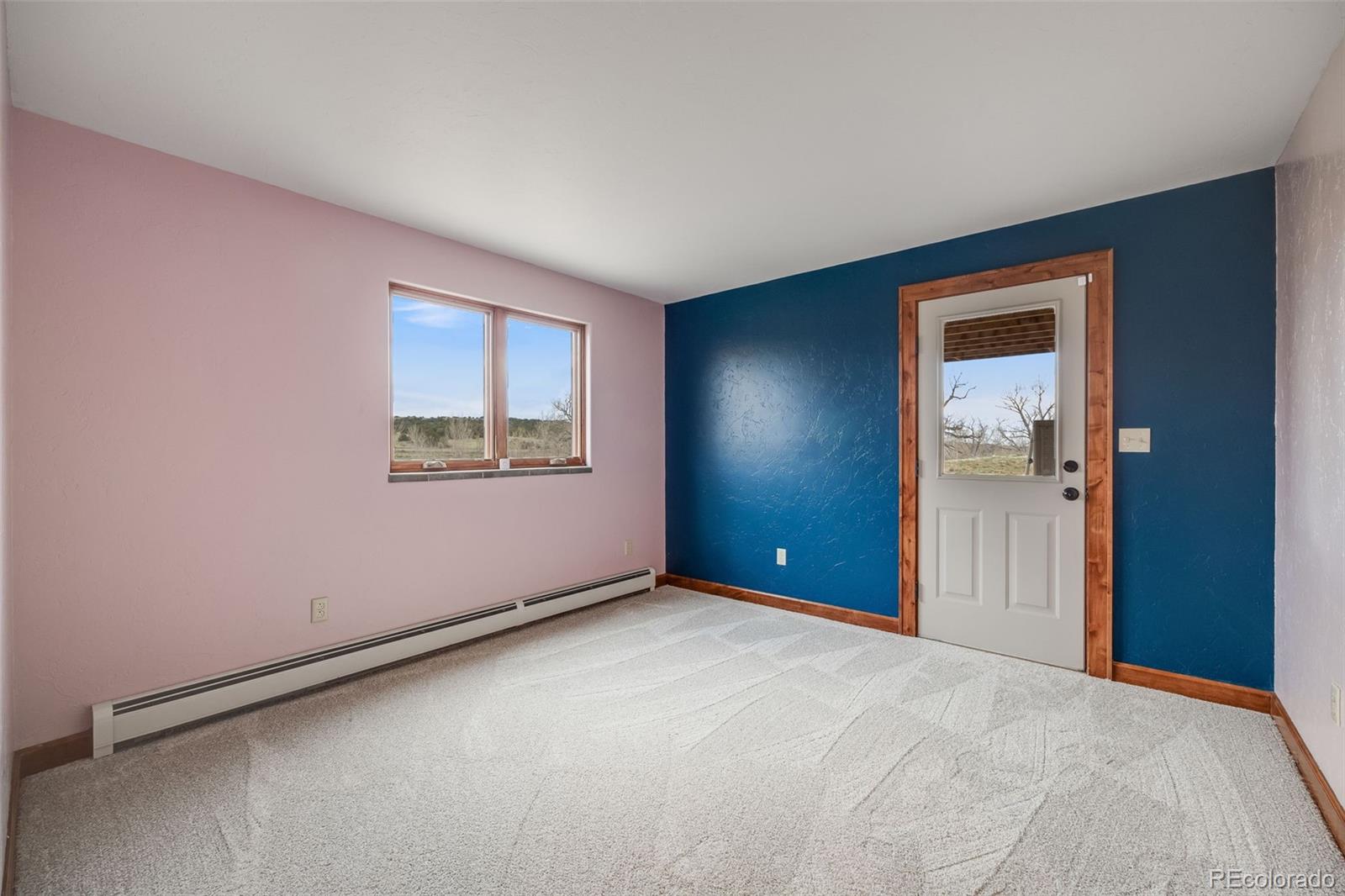 185 River Ridge Trail Walsenburg, CO 81089 - Photo 34 of 50 an empty room with windows and closet