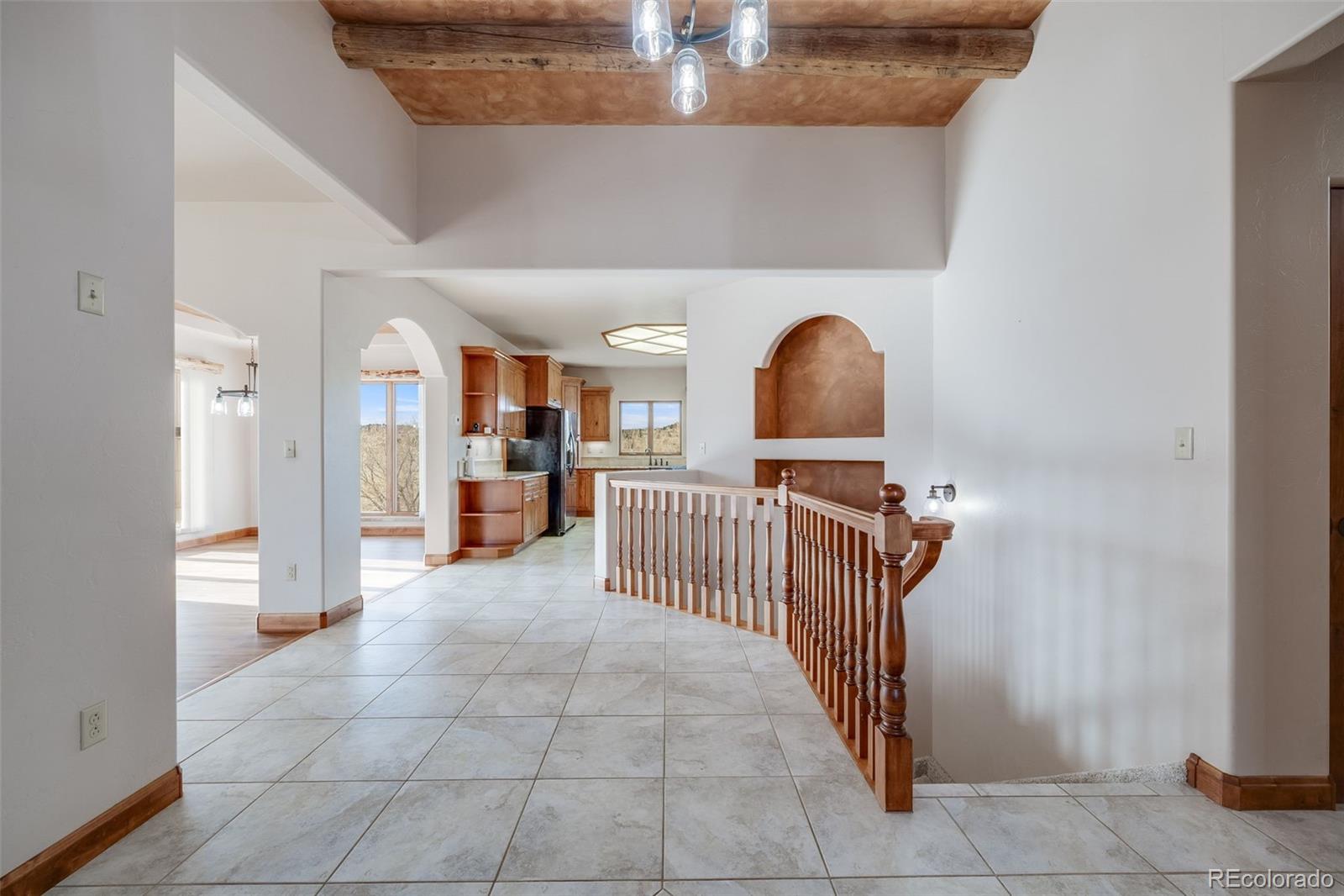 185 River Ridge Trail Walsenburg, CO 81089 - Photo 4 of 50 a view of a hallway with entryway wooden floor and windows