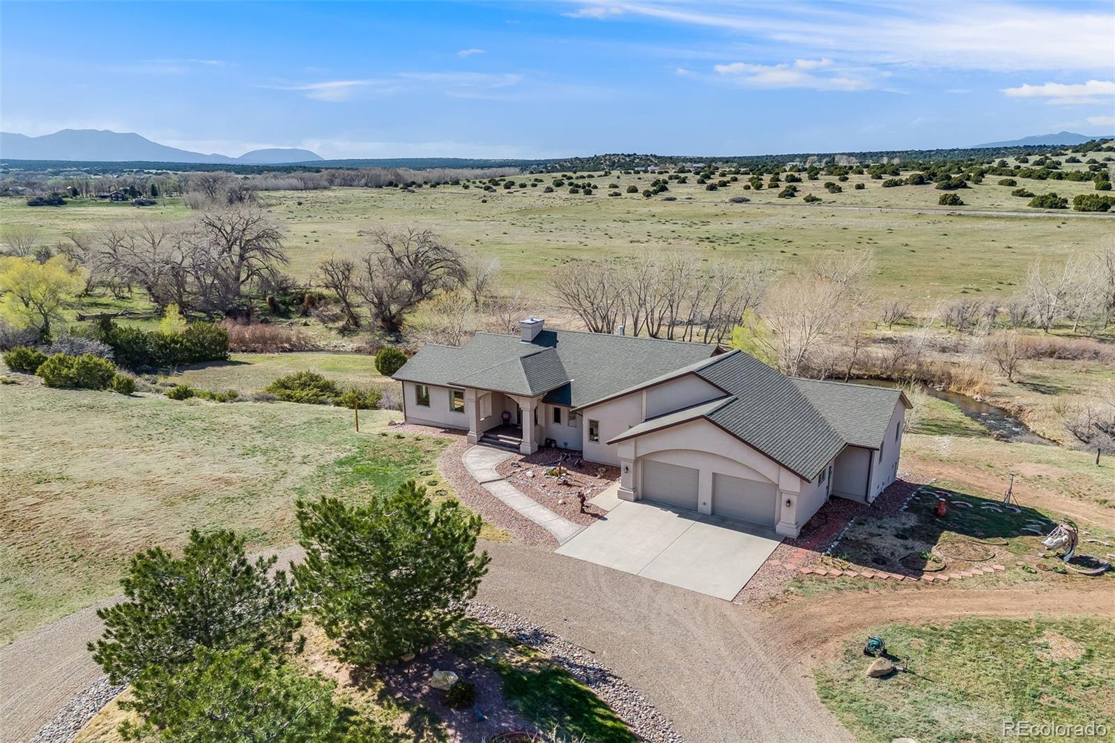 185 River Ridge Trail Walsenburg, CO 81089 - Photo 46 of 50 a aerial view of a house with a lake view
