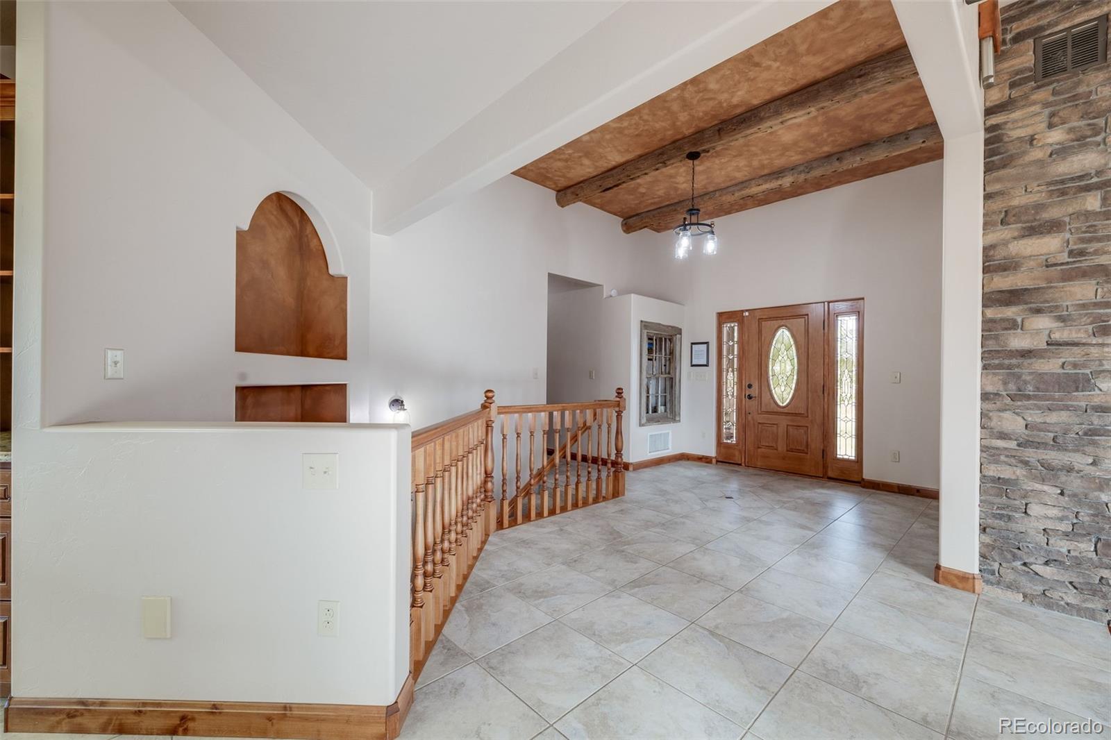 185 River Ridge Trail Walsenburg, CO 81089 - Photo 5 of 50 a view of a livingroom with a staircase