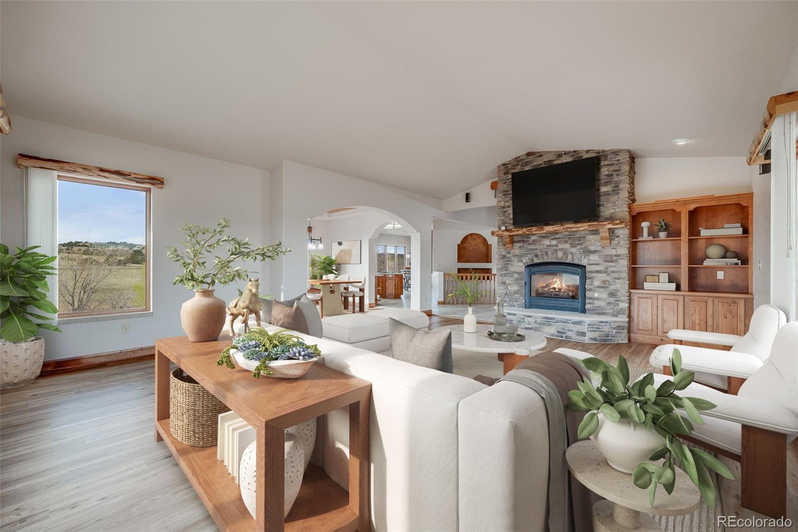 185 River Ridge Trail Walsenburg, CO 81089 - Photo 9 of 50 a living room with fireplace furniture and a flat screen tv