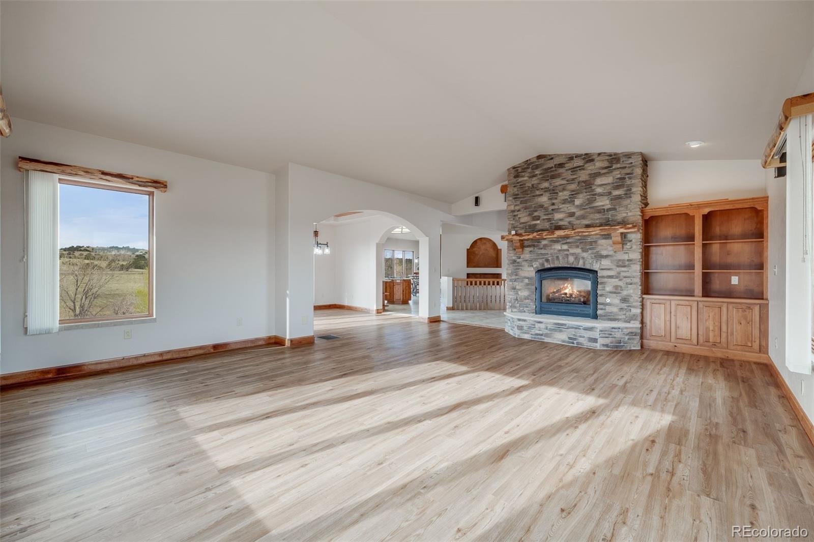 185 River Ridge Trail Walsenburg, CO 81089 - Photo 10 of 50 a living room with furniture and a fireplace