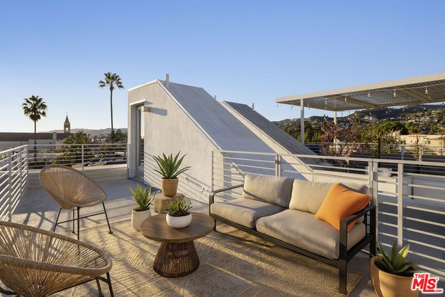 a view of a chairs in the roof deck