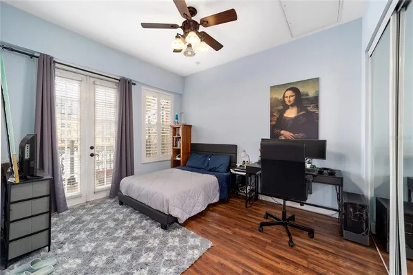 a bathroom with a sink toilet a mirror and shower curtain