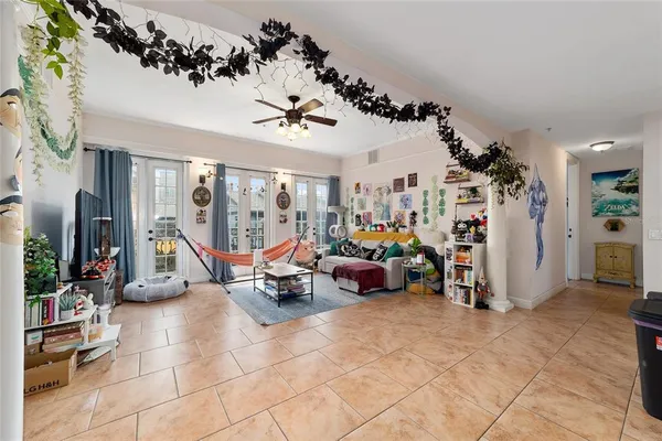 a living room with lots of furniture and a chandelier