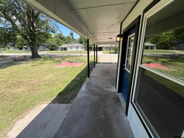 a view of a swimming pool with a porch