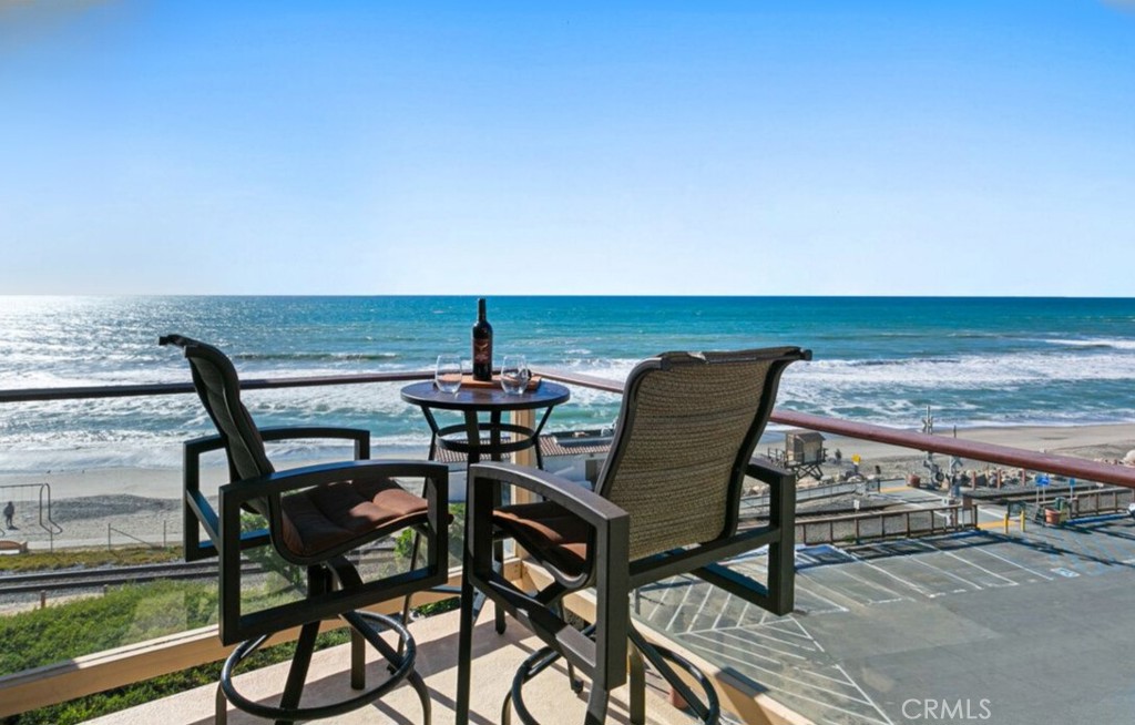 121 Boca De La Playa, Unit 1 San Clemente, CA 92672 - Photo 24 of 47 a view of a terrace with chair and table