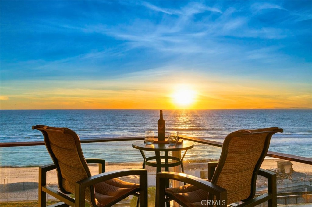 121 Boca De La Playa, Unit 1 San Clemente, CA 92672 - Photo 28 of 47 a view of a chairs and table on the terrace