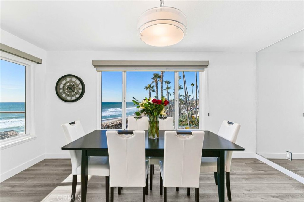 121 Boca De La Playa, Unit 1 San Clemente, CA 92672 - Photo 8 of 47 a view of a dining room with furniture and wooden floor