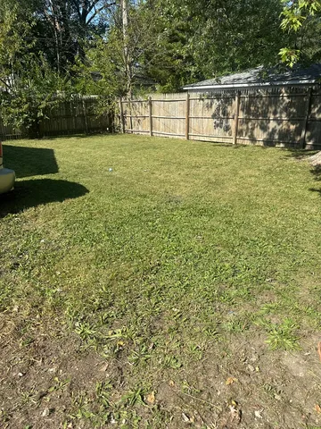 a view of outdoor space with deck and yard