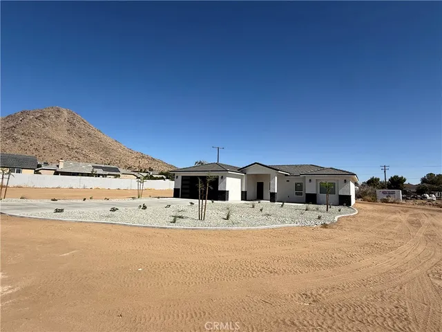 a view of a terrace with kitchen island in the background
