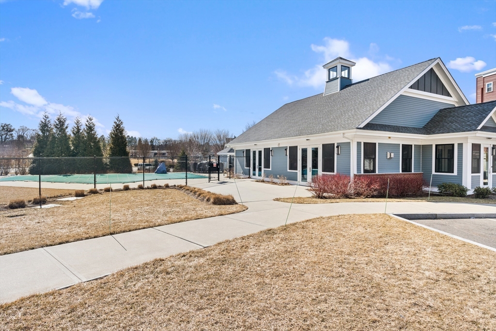60 Coppersmith Way, Unit 407 Canton, MA 02021 - Photo 28 of 34 a view of a house with a yard and sitting area