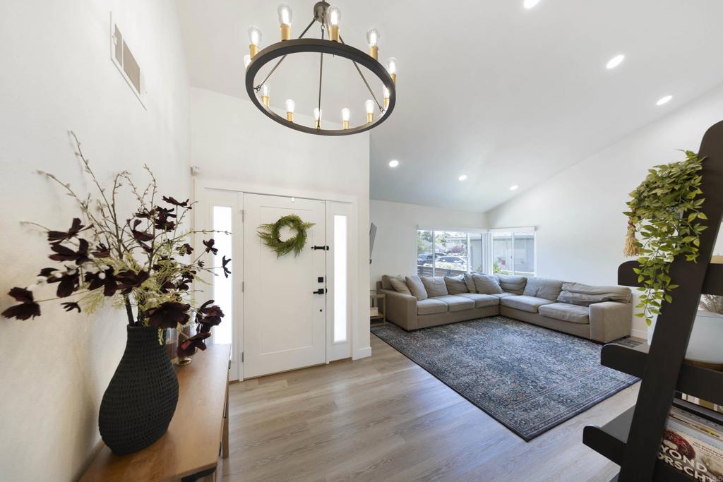 3577 Winslow Road Oceanside, CA 92056 - Photo 19 of 53 a living room with furniture flowerpot and a chandelier