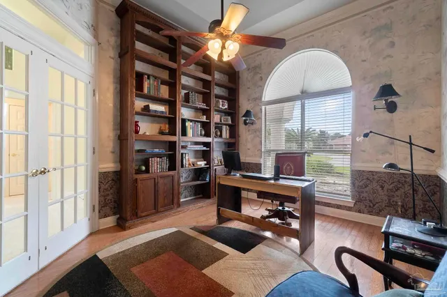 a workspace with furniture window and wooden floor