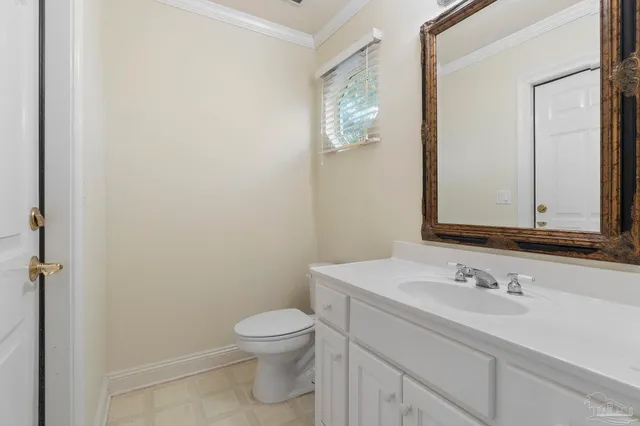 a bathroom with a sink a toilet and vanity
