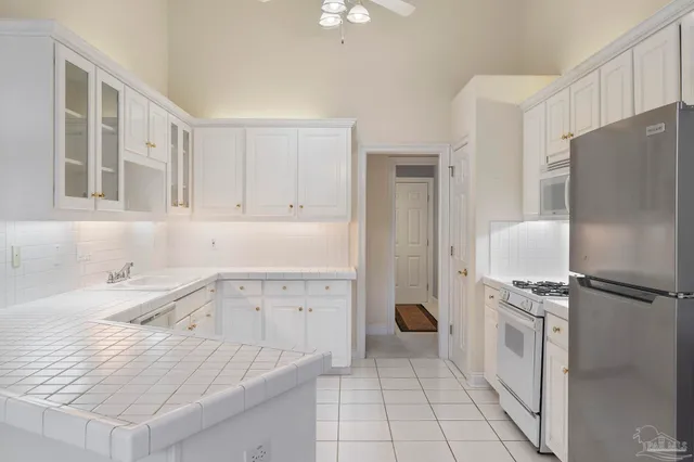 a view of a house with a backyard and porch