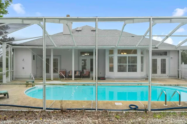 a view of a swimming pool with a patio