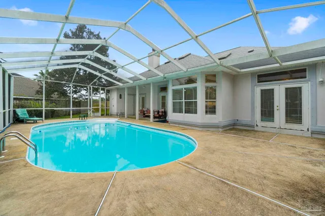 a view of a swimming pool with a patio