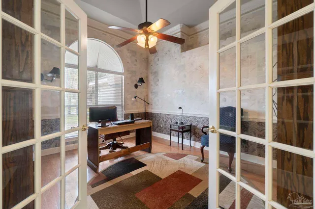 a view of a livingroom with furniture and a potted plant