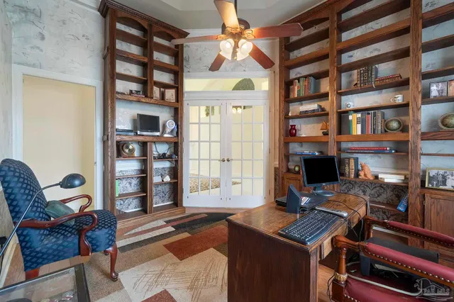 a workspace with furniture and bookshelf