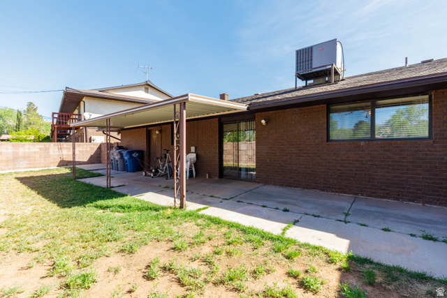 3707 Gates Circle Santa Clara, UT 84765 - Photo 18 of 19 Back of house with a patio area and brick siding