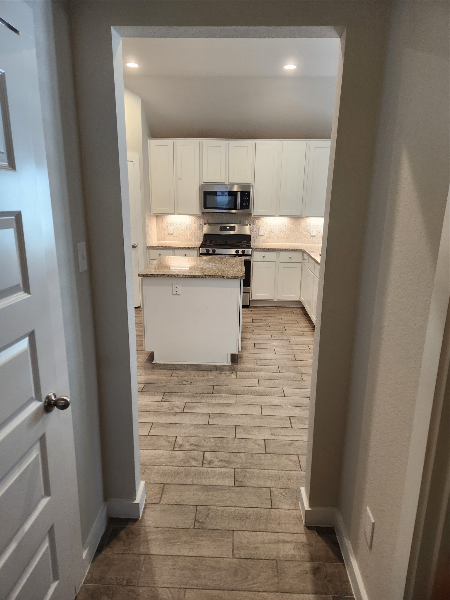 4326 Wyanngate Drive Spring, TX 77373 - Photo 12 of 29 a kitchen with a refrigerator and a stove top oven