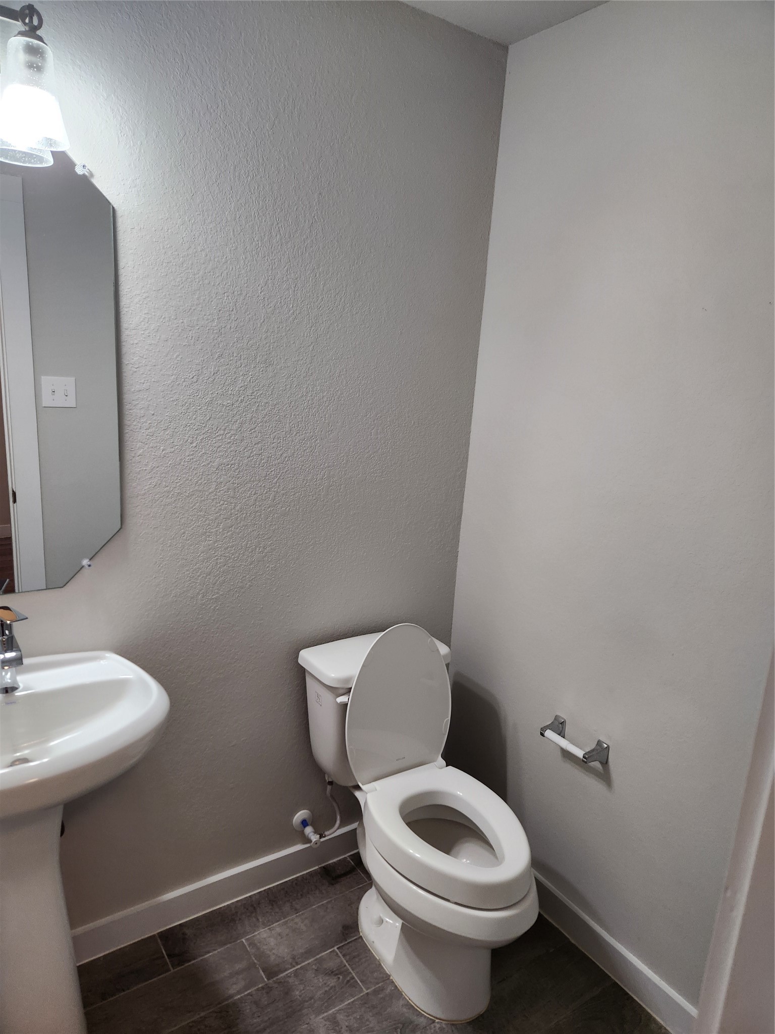 4326 Wyanngate Drive Spring, TX 77373 - Photo 13 of 29 a white toilet sitting next to a bathroom sink
