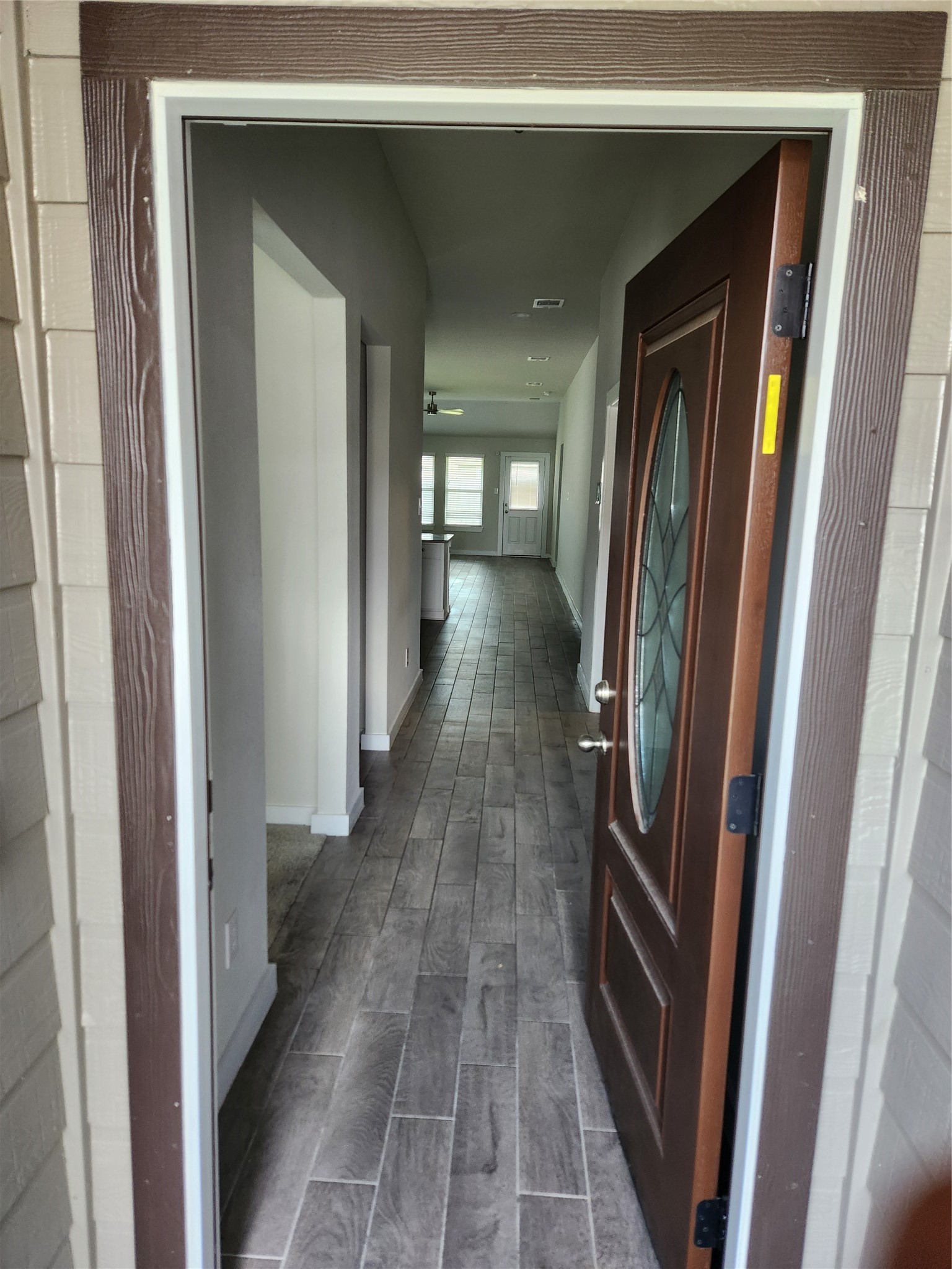 4326 Wyanngate Drive Spring, TX 77373 - Photo 2 of 29 a view of a hallway with wooden floor and staircase