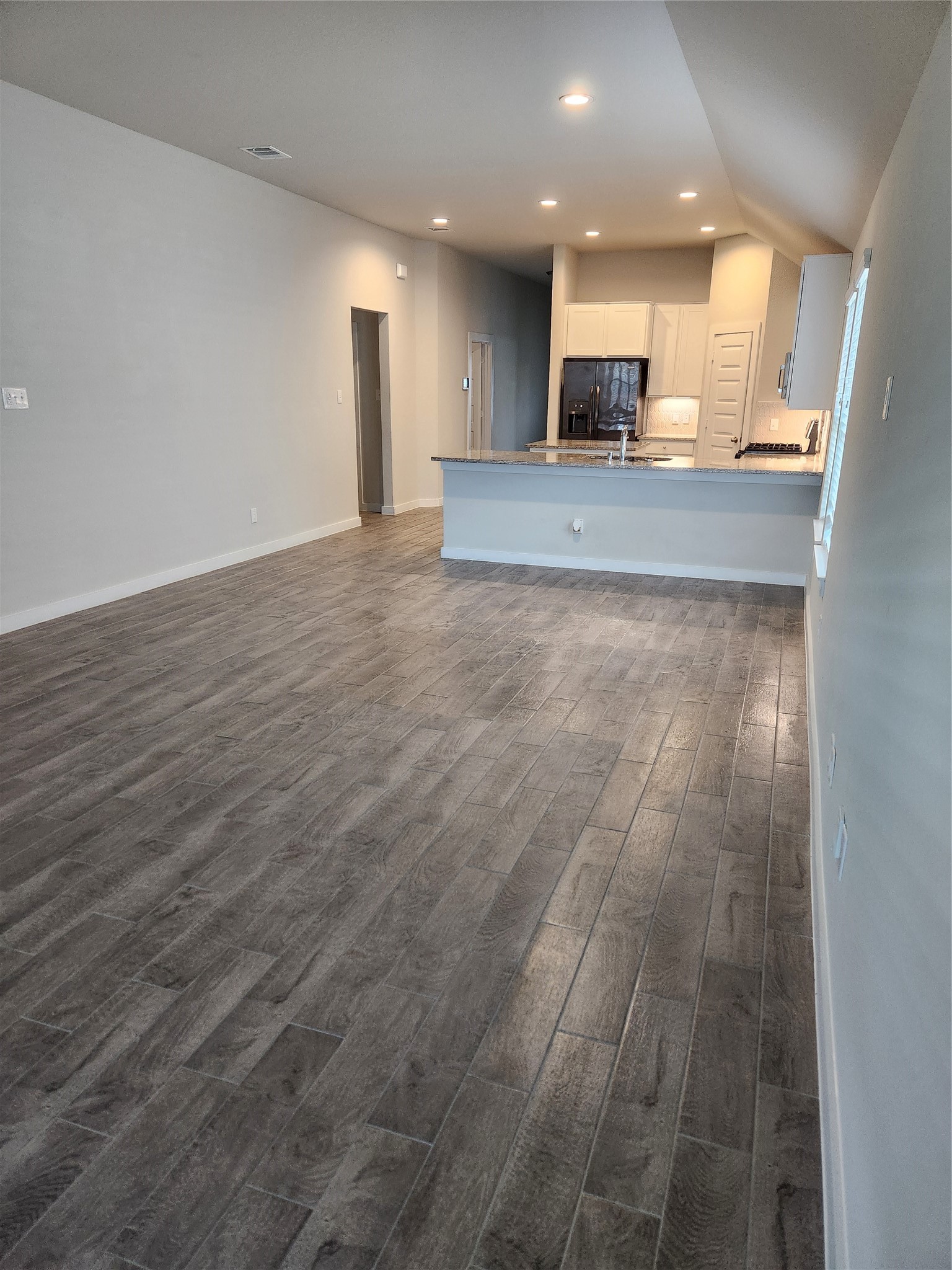 4326 Wyanngate Drive Spring, TX 77373 - Photo 21 of 29 a view of a kitchen with granite countertop cabinets and chandelier
