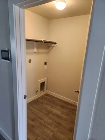 a view of room with window and hardwood floor