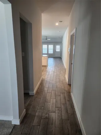 a view of gallery with wooden floor
